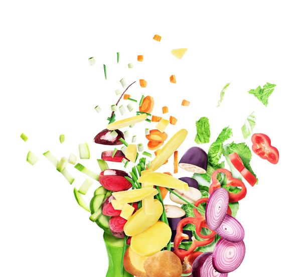 Sliced vegetables scatter on a white background - Zdjęcie, obraz