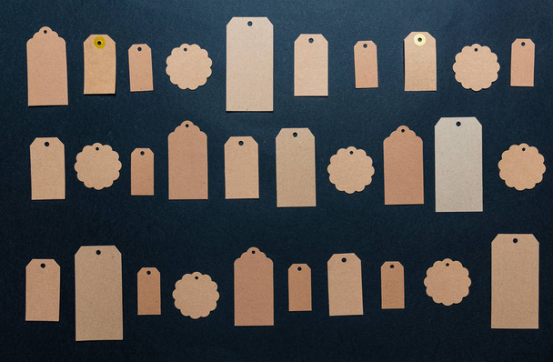 Beige recycled price cards against black background - Фото, зображення