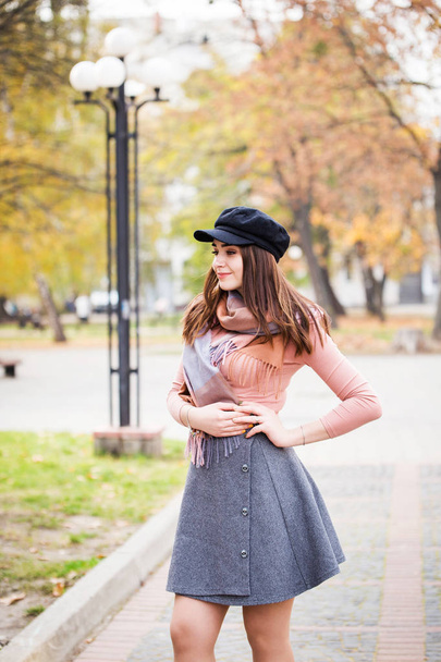 stylish woman in autumn park - Fotó, kép
