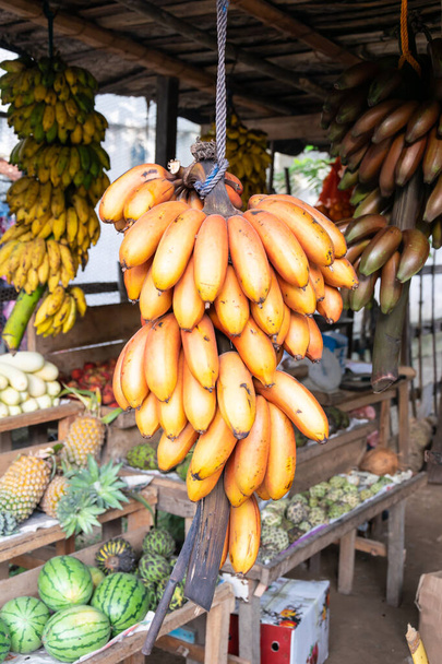 Stack of bananas in the open air fruit market - 写真・画像