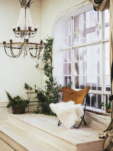beige wicker chair near the window. Scandinavian style living - Fotó, kép