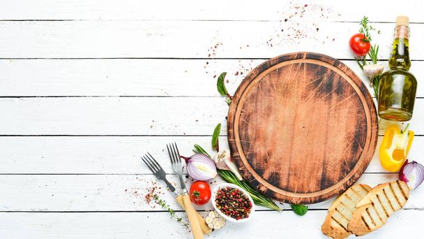 White cooking banner. Kitchen board with vegetables and spices. Top view. Free copy space. - Fotografie, Obrázek