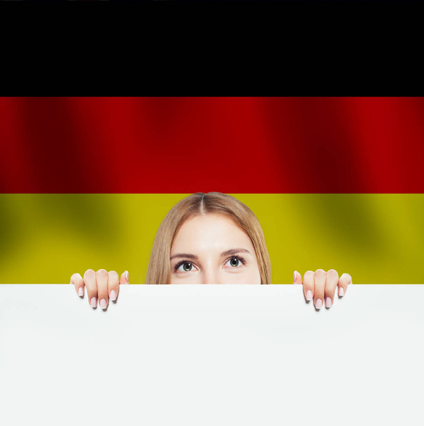 Travel in Germany concept. Pretty woman showing white background - Photo, Image