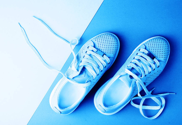 Sports shoes on a colorful background. View from above. - 写真・画像