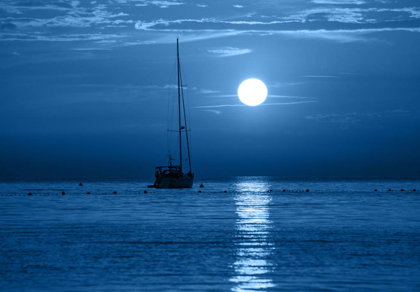 Beautiful night sea, yacht and full moon. Night classic blue seascape. Trendy Banner with color of the year 2020 - Photo, Image