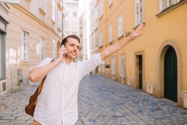 Young man background the old european city take selfie - Photo, image