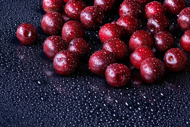 Fresh washed cherry berries with water drops on a background - 写真・画像
