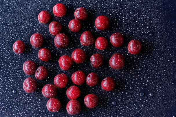 Fresh washed cherry berries with water drops on a background - Zdjęcie, obraz
