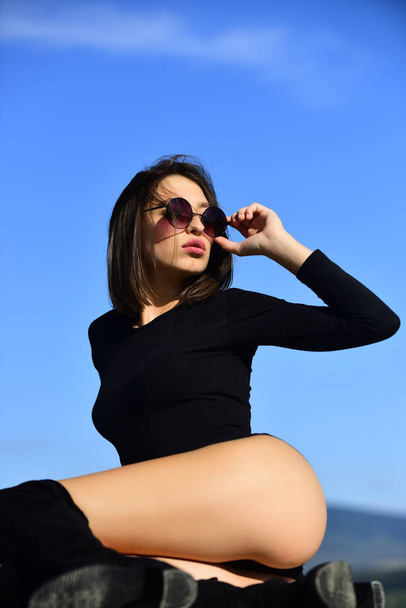 Hot babe. Female fashion model posing with sunglasses. Passion and temptation. Women in erotic underwear. Concept of beauty. Portrait of a young woman in sunglasses. Beauty trends. Isolated on sky. - Foto, Imagem
