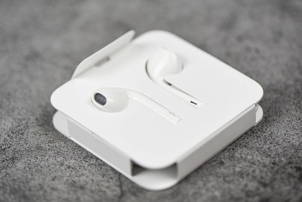 White wireless bluetooth earphones or headphones smartphone Earp - Photo, Image