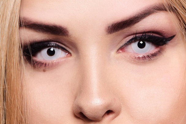 White lenses on a blonde. Eye close-up. Gorgeous eye makeup. How - Фото, изображение