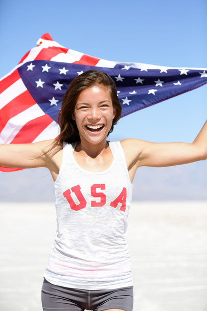 Athlete woman with american flag and USA t-shirt - Foto, imagen