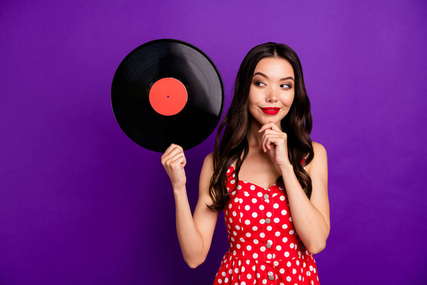 Portrait of her she nice-looking attractive lovely winsome cheerful foxy sly cunning wavy-haired girl holding in hand vinyl isolated on bright vivid shine vibrant lilac purple violet background - Photo, Image
