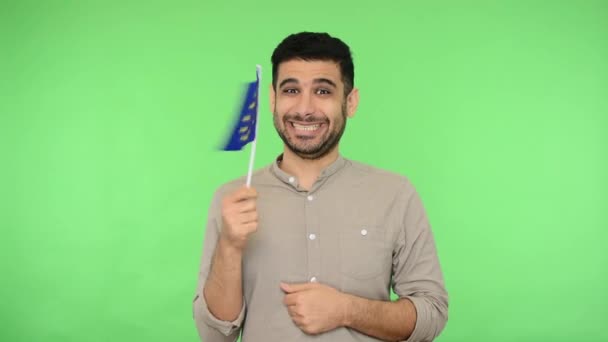 Look at European Union flag! Portrait of joyous excited brunette - Séquence, vidéo