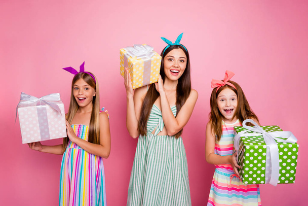Portrait of three people hold get giftbox for 8-march having blonde brunette haircut wearing bright headbands skirt isolated over pink - Φωτογραφία, εικόνα