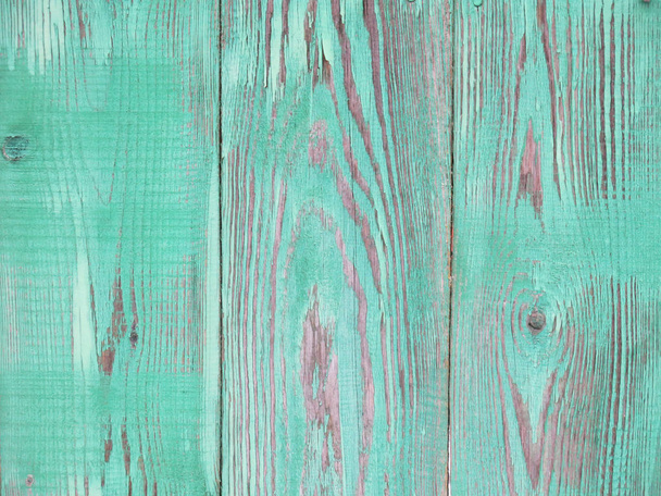 texture of bright green vintage wooden fence with peeling paint   - Foto, imagen