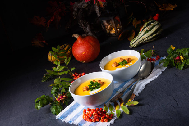 Delicious pumpkin soup with croutons and coconut milk - Фото, изображение