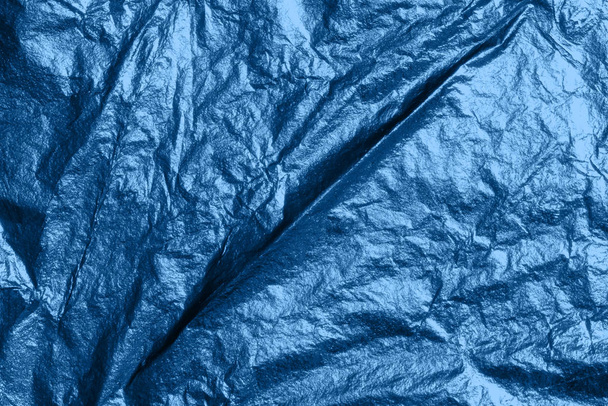 Silver bright shiny texture of a crumpled sheet. - Photo, image