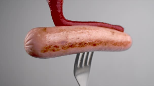 Tomato hot sauce drops to the sausage in slow motion, tomato ketchup with meat, sausage on fork, Full HD 120fps Prores HQ - Footage, Video