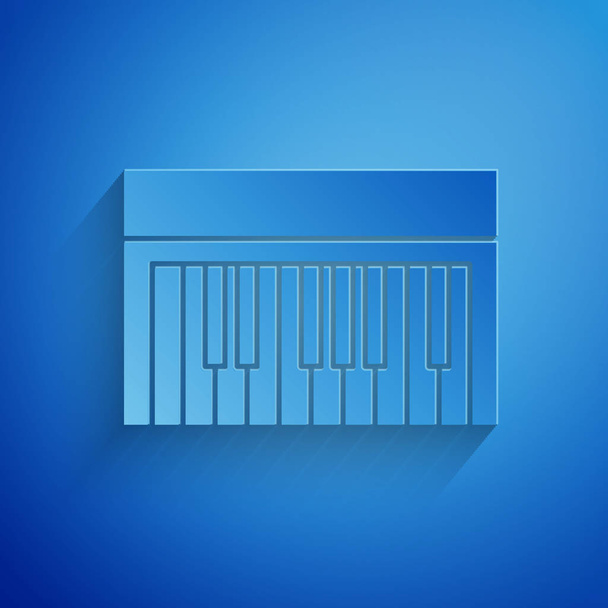 Иконка музыкального синтезатора вырезана на синем фоне. Электронное пианино Бумажный стиль. Векторная миграция
 - Вектор,изображение