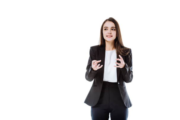 irritated businesswoman in suit gesturing isolated on white - Valokuva, kuva