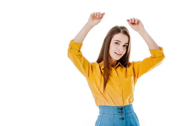 smiling attractive girl with hands in air isolated on white - Fotografie, Obrázek