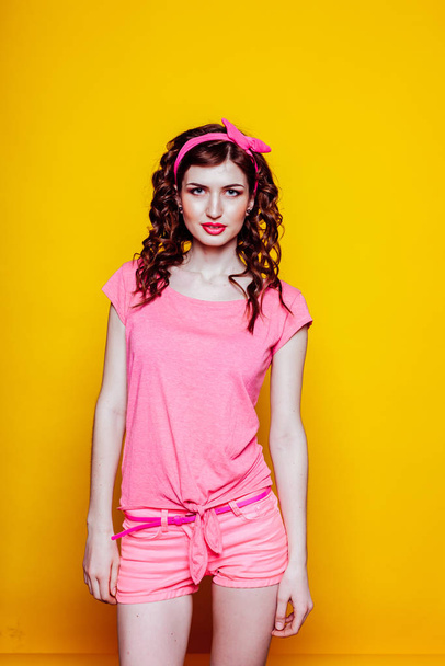 girl pinup style in a pink dress - Φωτογραφία, εικόνα