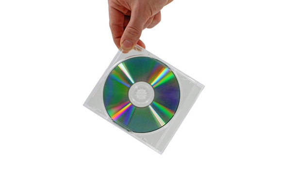 mão masculina segurando CD com caixa transparente isolado no fundo branco
 - Foto, Imagem