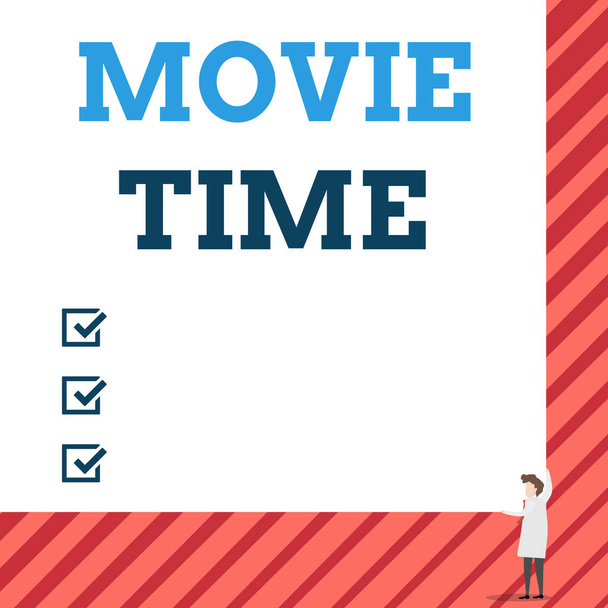 Handwriting text Movie Time. Concept meaning the scheduled or actual time at which a show or film begins One man professor wear white coat red tie hold big board use two hands. - Photo, Image