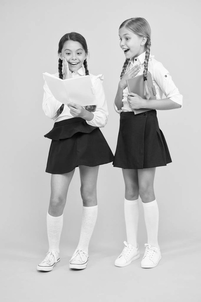 School friendship. Most important thing one learns in school is self esteem support and friendship. Friendship goals. Cute school girls with books. First day at school. Sharing gossips personal diary - Fotoğraf, Görsel