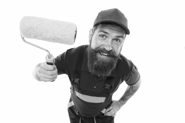 Skillful and professional painter. Bearded man painter isolated on white. Wall painter with painting tool. Brush roller painter. Painters work. Construction and renovation. Decoration and decor - Φωτογραφία, εικόνα