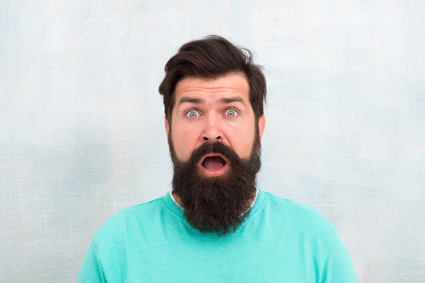 Shocked. Wondering what. Hipster appearance. Man bearded hipster stylish beard. Stylish beard and mustache care. Beard fashion and barber concept. Perceptions of male beauty around the world - Foto, Bild
