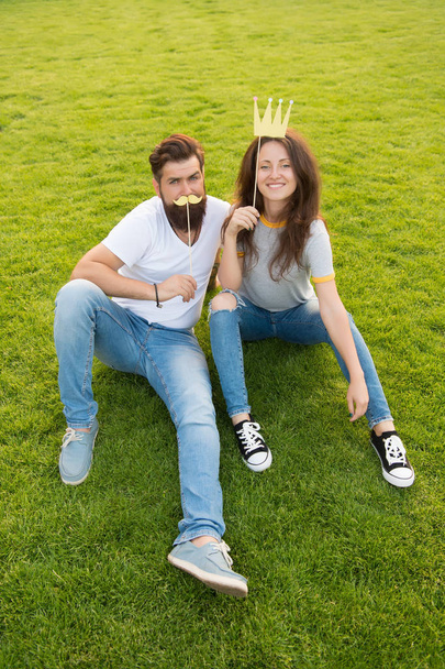 Princess and hipster. Couple in love youth booth props. Emotional people. Summer vacation. Couple dating. Carefree couple having fun green lawn. Man and pretty woman cheerful faces. Youth day - Photo, Image