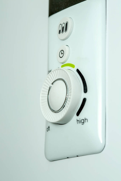 Closeup view of the water heater thermostat. - Photo, Image