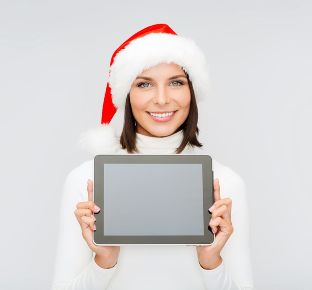 Woman in santa helper hat with tablet pc - Foto, Imagen