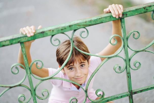 Little girl, eight years old, having fun in an urban park. - Photo, Image