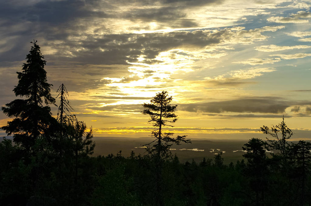 Sunset view to taiga forest and lakes from Mountain Vottovaara, Karelia, Russia - Photo, Image
