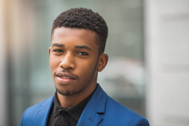 handsome young african man in a blue jacket - Fotoğraf, Görsel
