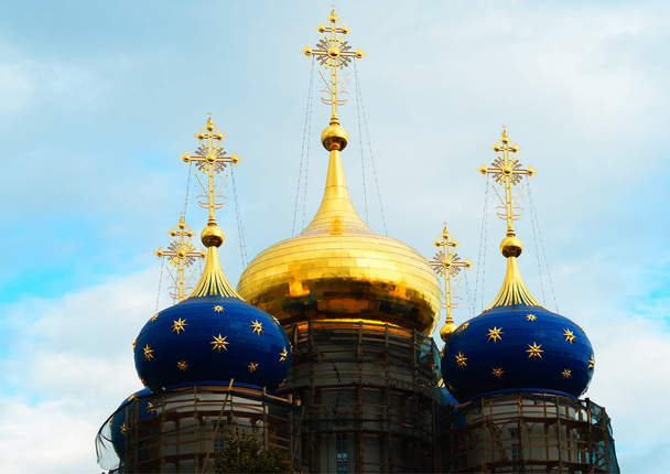 Golden domes of Russia under construction architecture background - Photo, Image