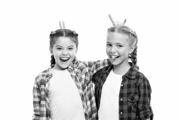 In playful mood. Happy children make horns each other isolated on white. Little children smile in casual style. Beauty look of adorable children. Small children have fun together. Childhood friends - Foto, imagen