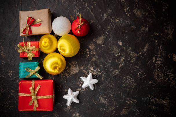Christmas gifts and decorative objects with dark background top  view with dark background - Photo, Image