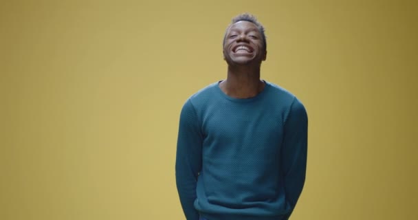 Young man showing different facial expressions - Felvétel, videó