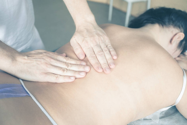 Close up of therapist doing  massage on woman - Фото, зображення