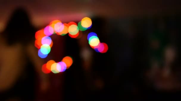 Fun party. Group of friends are relaxing, dancing and having fun in nightclub or musical concert. Abstract defocused background. Blurred motion. - Footage, Video