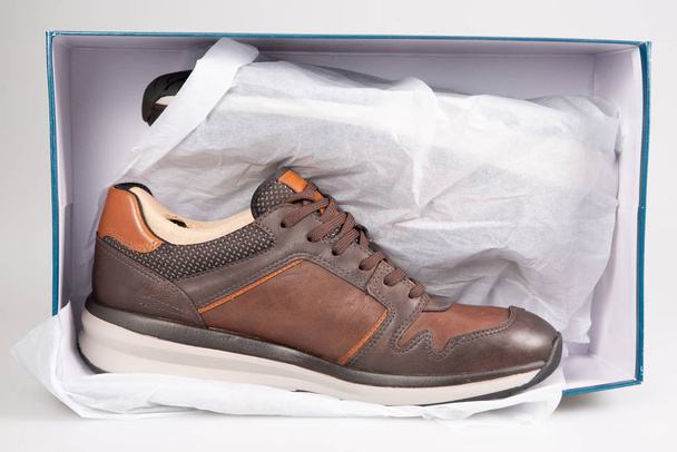 brown sneakers men on white paper box - Photo, Image