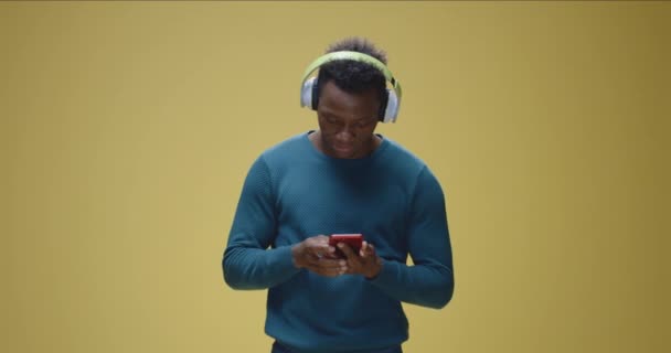 Young man enjoying music - Felvétel, videó