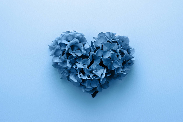 Classic Valentines heart shape made of flowers on blue color year 2020 - Photo, Image