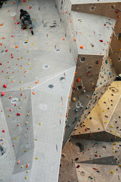 Climber  in climbing gym  - Фото, изображение