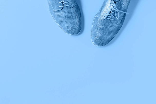 Pair of shiny blue shoes on monochrome background - Photo, Image