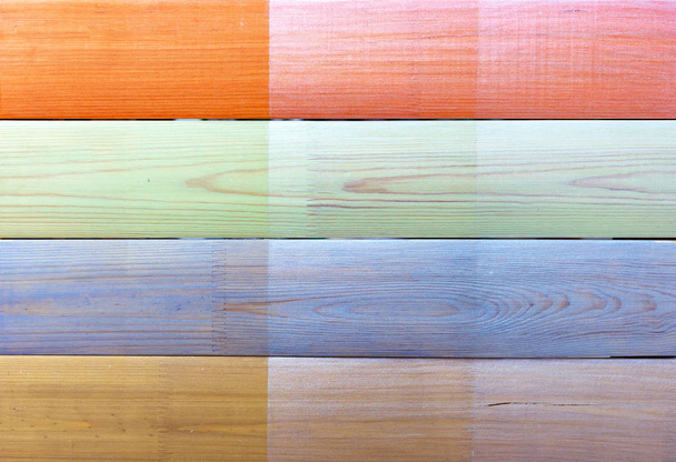 Tavole semicircolari con diversi campioni di vernici. Sfondo e texture di tavole di legno colorate
. - Foto, immagini